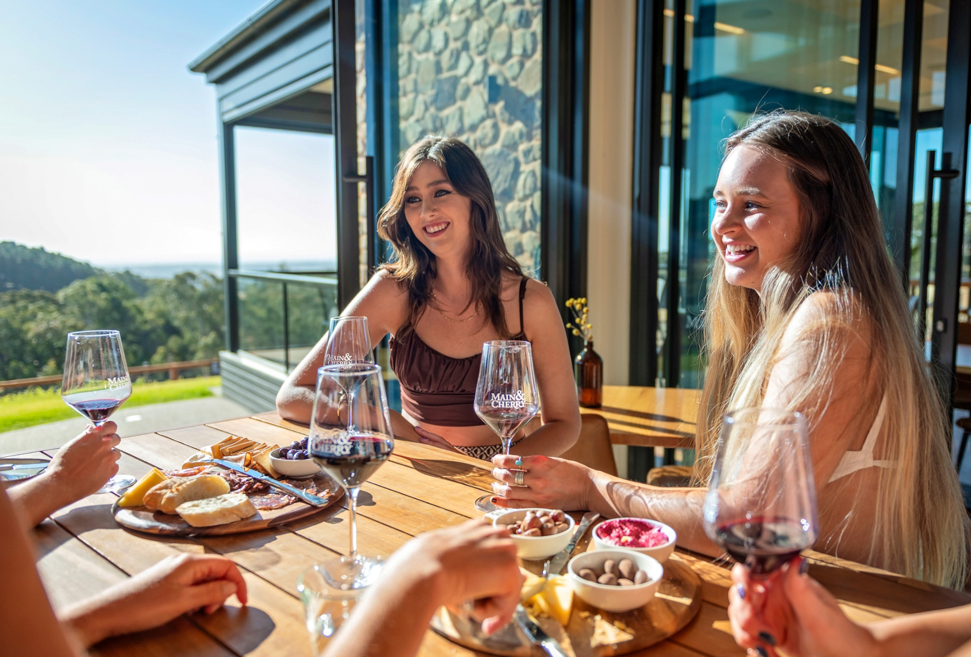 Patrons enjoying good wind and food at the Main & Cherry cellar door.